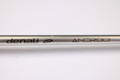 A close-up of a Denali Android ADC744WJ 7'4" Heavy used casting rod in good condition, showing "Denali" and "ANDROID" with a logo engraved on the metallic rod, set against a white background—ideal for our rod and reel trade-in program.