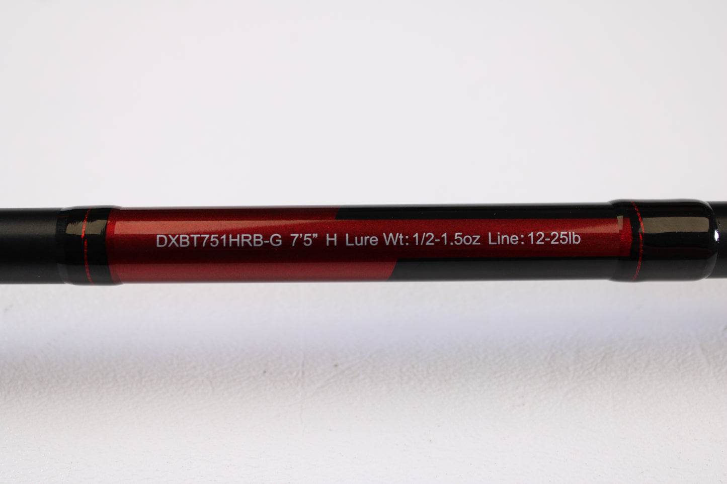 A close-up of the Daiwa DXB DXBT751HRB-G 7'5" Heavy Glass casting rod (used, excellent condition) displays specs—ideal for those browsing used gear or our rod and reel trade-in program.