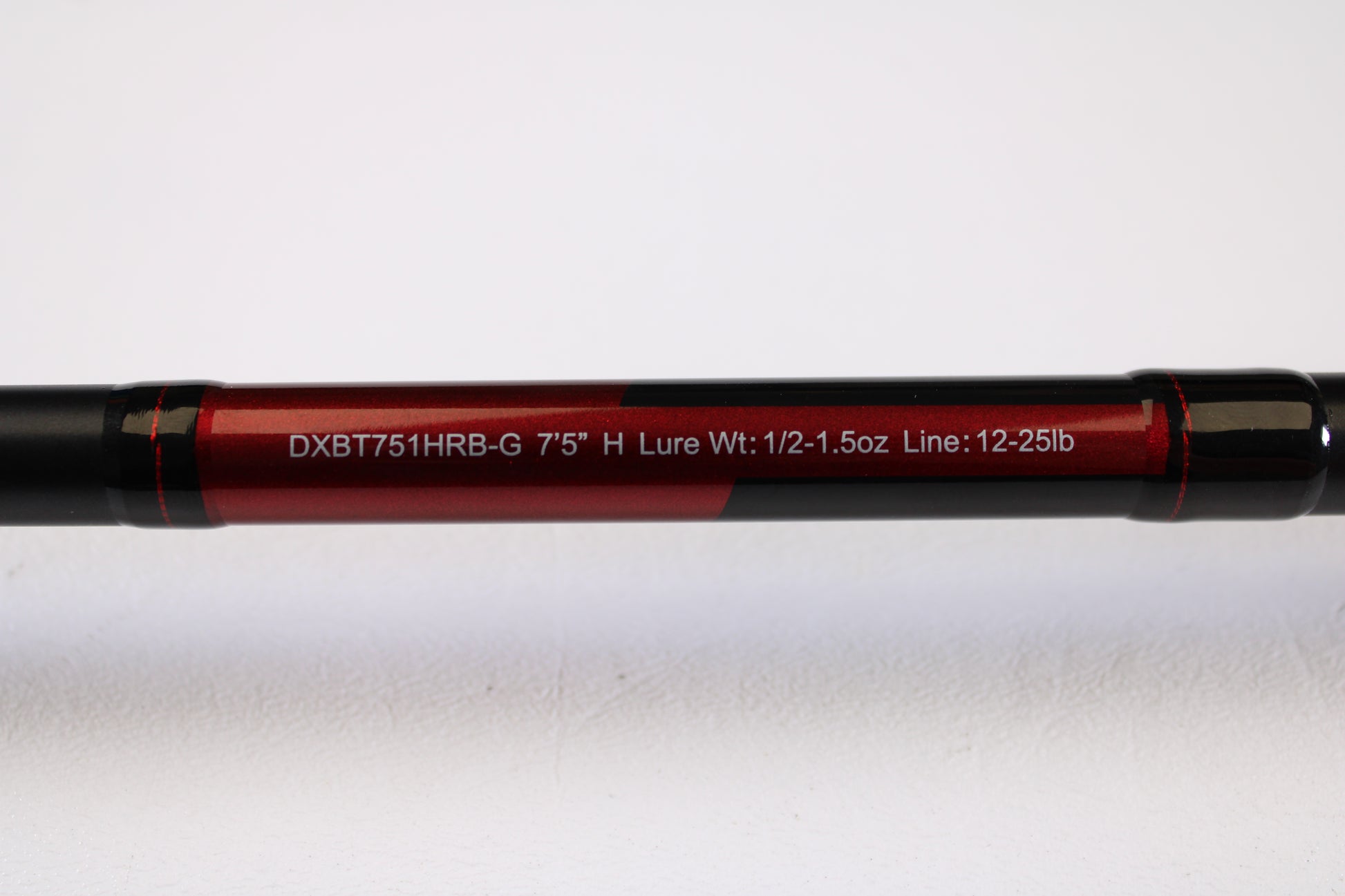 A close-up of the Daiwa DXB DXBT751HRB-G 7'5" Heavy Glass casting rod (used, excellent condition) displays specs—ideal for those browsing used gear or our rod and reel trade-in program.