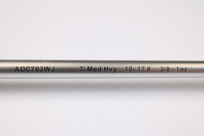 A close-up of the Denali Android ADC703WJ 7'0" Medium Heavy Used Casting Rod in good condition, showing black and red labeling on a silver surface, featured in our used gear trade-in program against a white background.