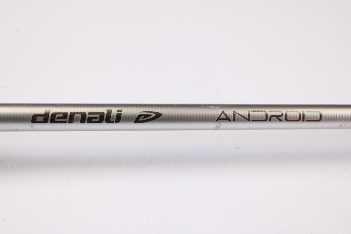 A close-up of the Denali Android ADC703WJ 7'0" Medium Heavy Used Casting Rod in good condition with "Denali" and "ANDROID" printed on it, ideal for trade-in toward store credit when upgrading your fishing gear.