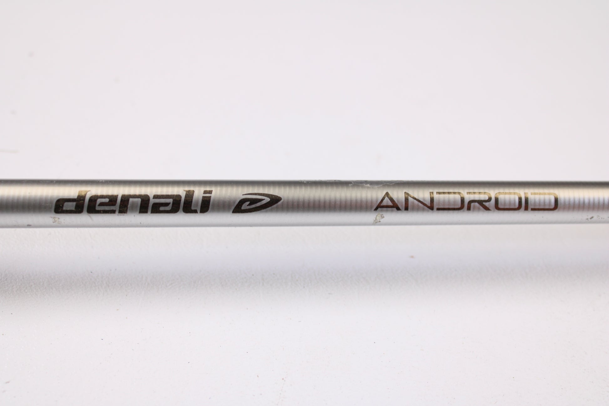 A close-up of the Denali Android ADC703WJ 7'0" Medium Heavy Used Casting Rod in good condition with "Denali" and "ANDROID" printed on it, ideal for trade-in toward store credit when upgrading your fishing gear.