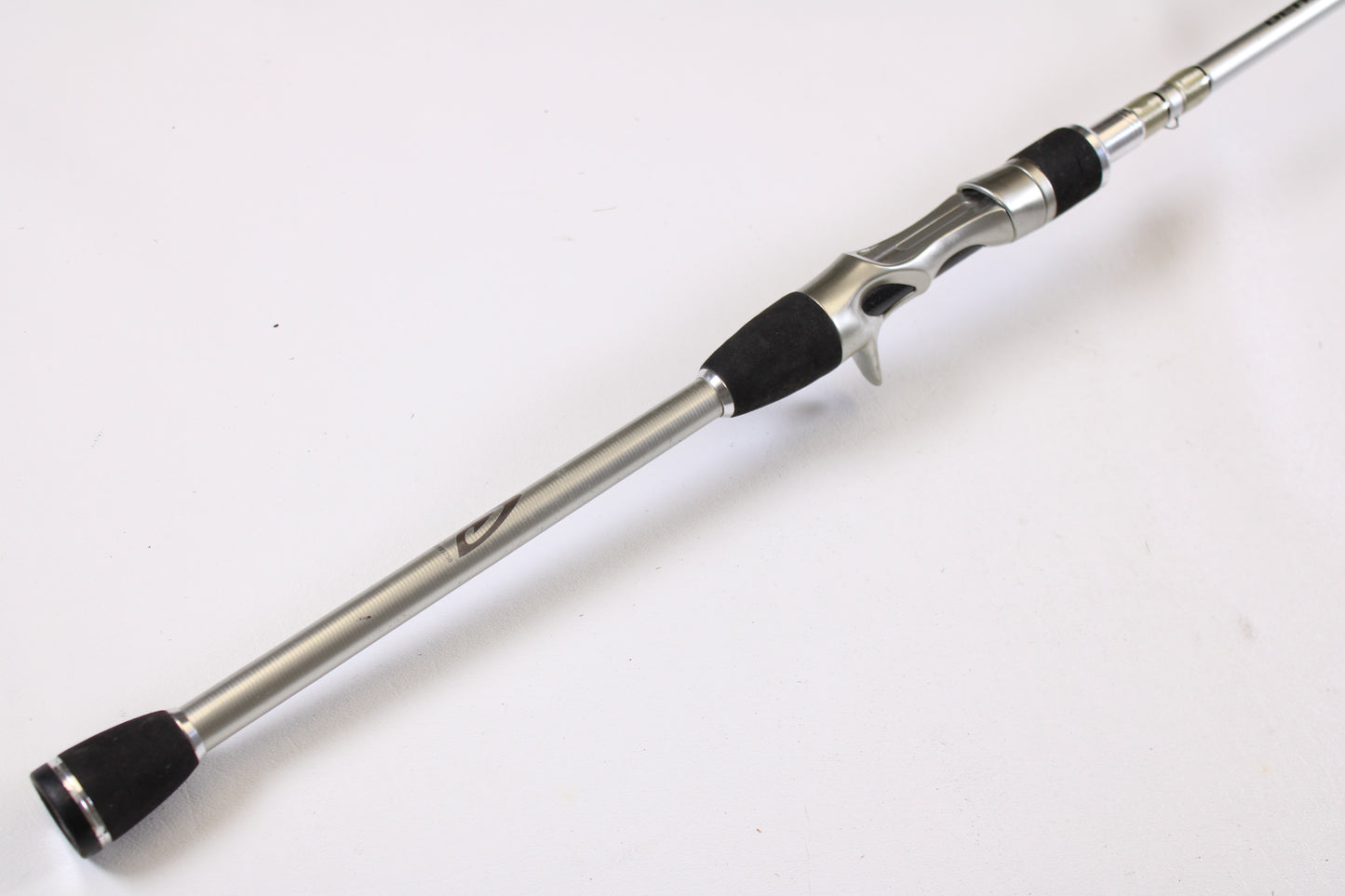 A close-up of the Denali Android ADC704WJ 7'0" Heavy Used Casting Rod in good condition, with a sleek metallic handle and black grip—ideal for upgrading through our Rod and Reel Trade-In Program for store credit on used Denali gear.