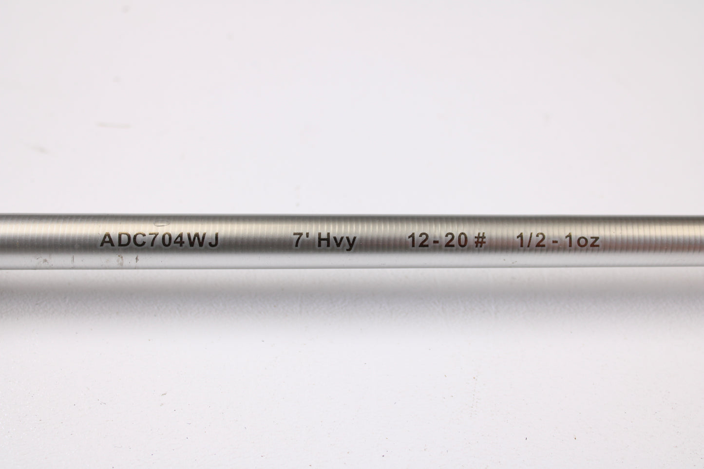A close-up of the Denali Android ADC704WJ 7'0" Heavy Used Casting Rod in good condition, with printed specs, on a white background—ideal for those looking to upgrade via the Rod and Reel Trade-In Program.
