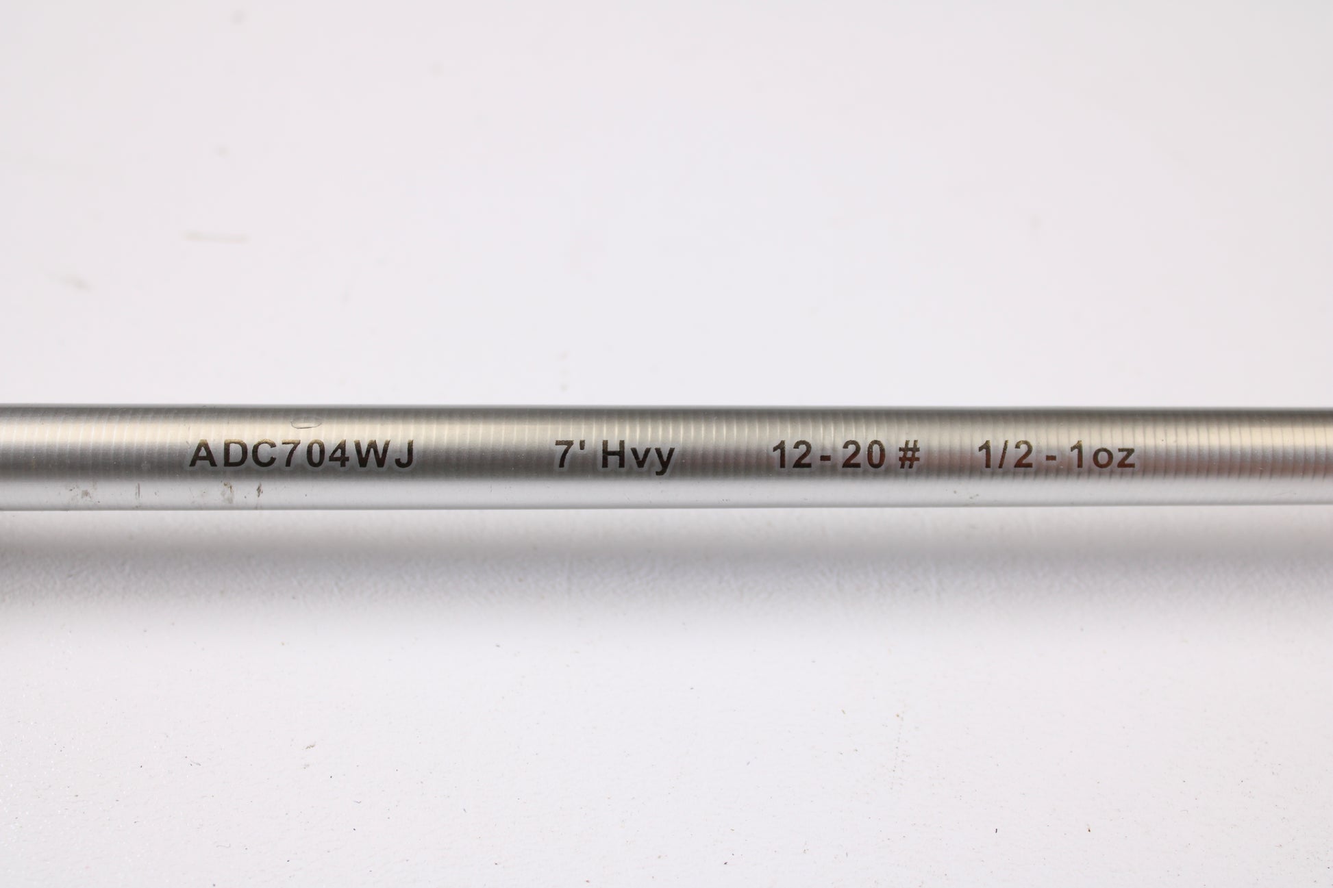 A close-up of the Denali Android ADC704WJ 7'0" Heavy Used Casting Rod in good condition, with printed specs, on a white background—ideal for those looking to upgrade via the Rod and Reel Trade-In Program.