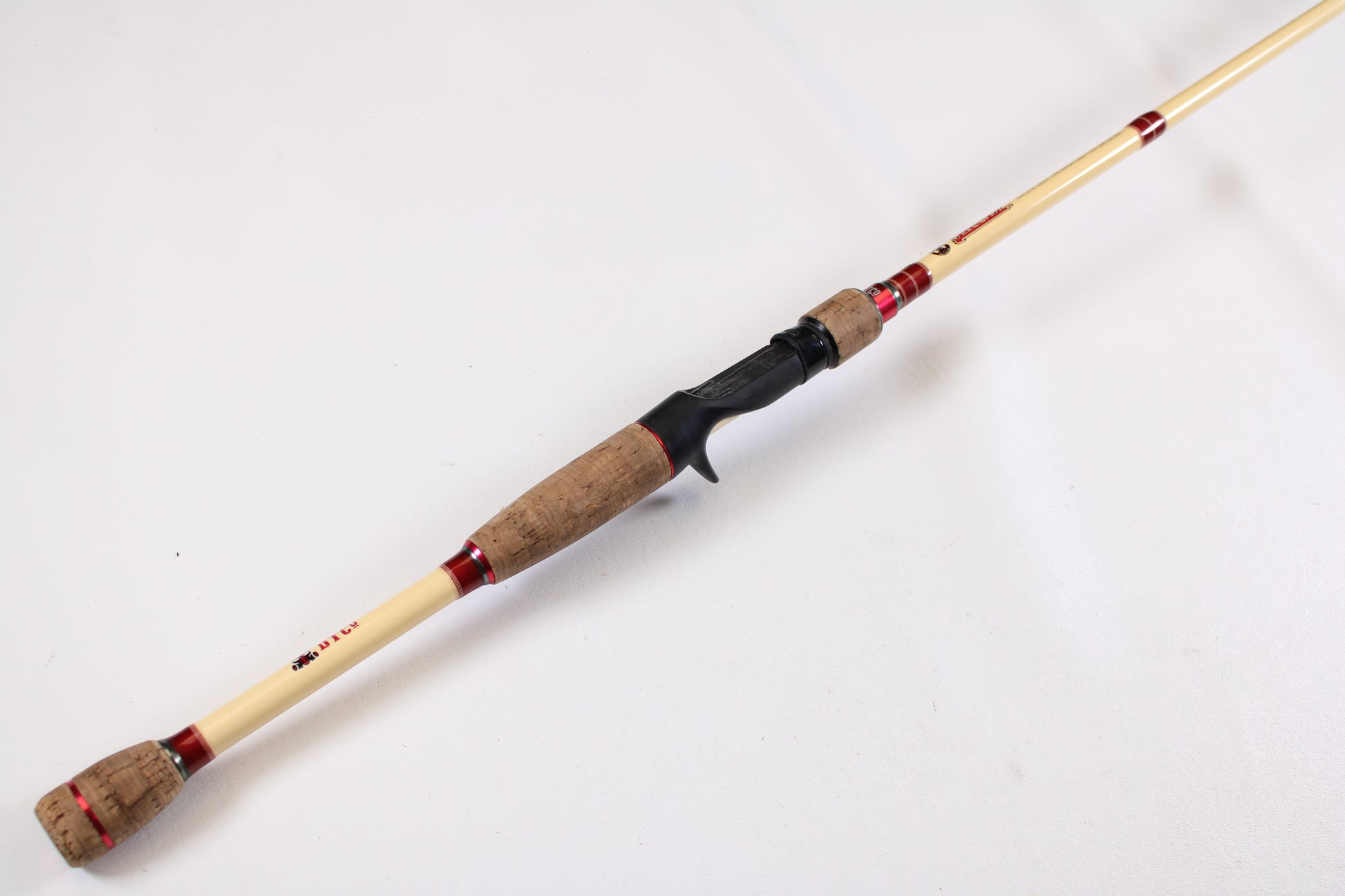 A Doomsday Tackle Co. The 47 T47C-673F 7'3" Heavy used casting rod in very good condition, displayed diagonally on a white background—ideal for those seeking quality used gear or extra value with our rod and reel trade-in program.