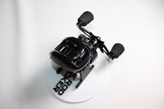 A 13 Fishing Inception G2 ING2-7.3-LH Used Casting Reel in very good condition is displayed on a white disc with black text—ideal for upgrades with our Rod and Reel Trade-In Program for store credit on used gear.