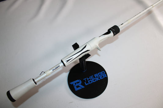 A 13 Fishing Fate V3 FV3C71M 7'1" Medium used casting rod in good condition, with black accents, is shown on a stand labeled "THE ROD LOCKER" against a plain white background.