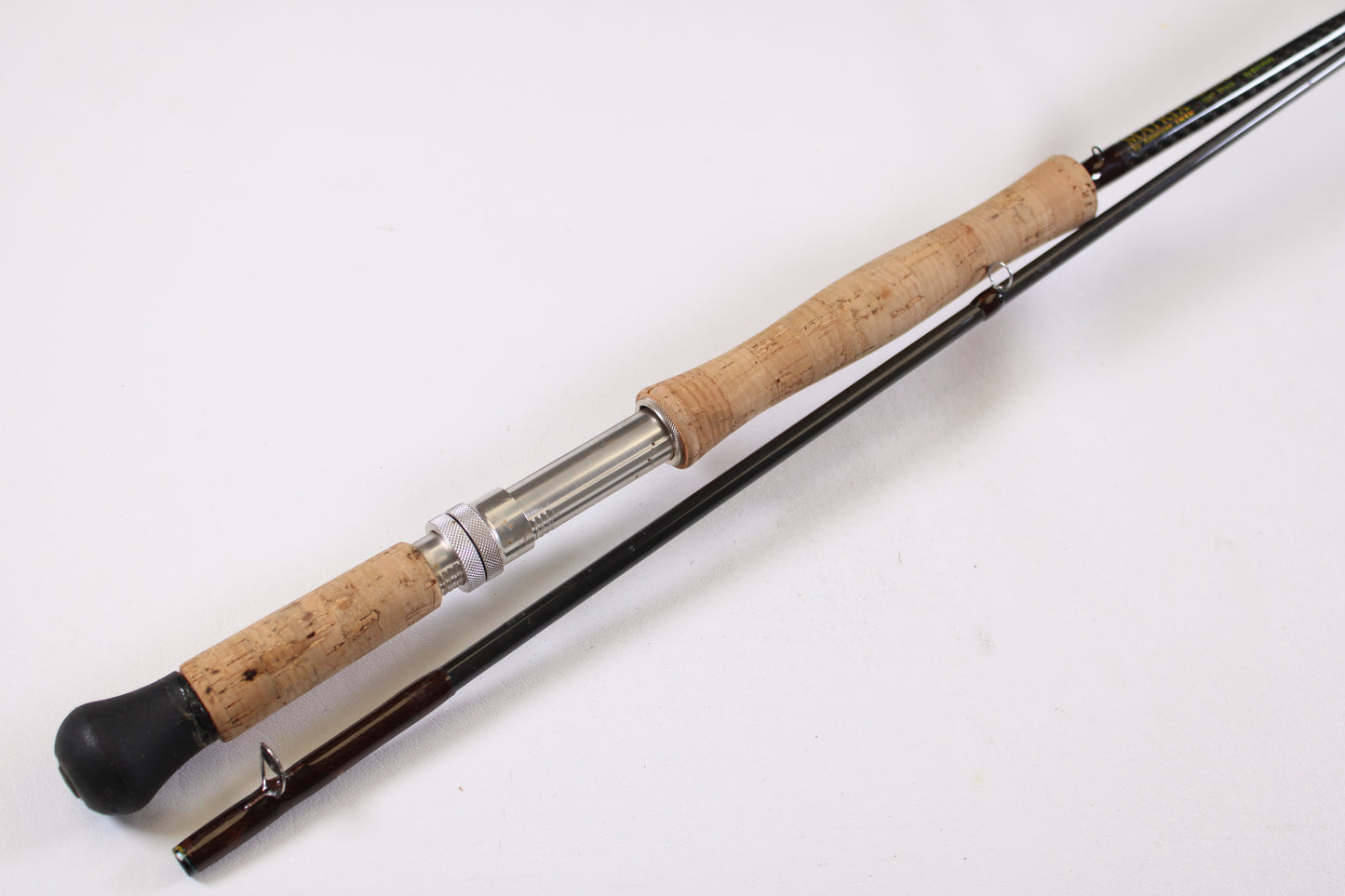 The American Tackle Matrix 10'6" 10WT 2 Piece Used Fly Rod (Excellent Condition) is shown partially disassembled, highlighting the quality of pre-owned gear available through our Rod and Reel Trade-In Program.