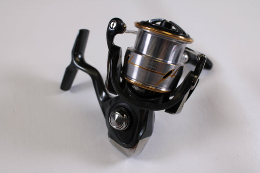A close-up of a Daiwa Luvias LT 20LUVIAS LT 3000S-CXH 6.2:1 spinning reel in very good used condition—ideal for anyone interested in quality gear or our Rod and Reel Trade-In Program.