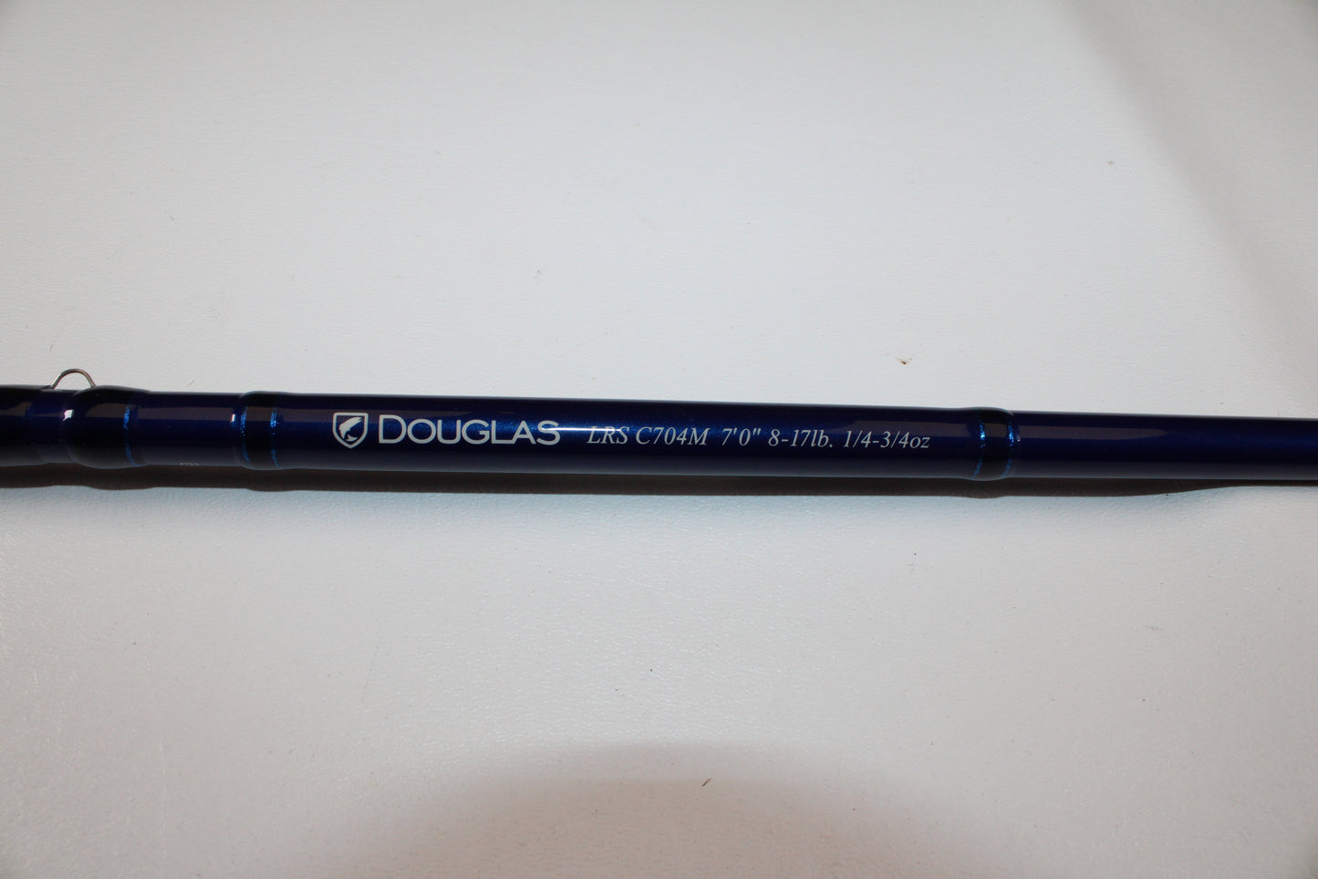 A close-up of the Douglas LRS C704M 7'0" Medium Used Casting Rod in excellent condition against a white background—an ideal upgrade for anglers through our Rod and Reel Trade-In Program for store credit.