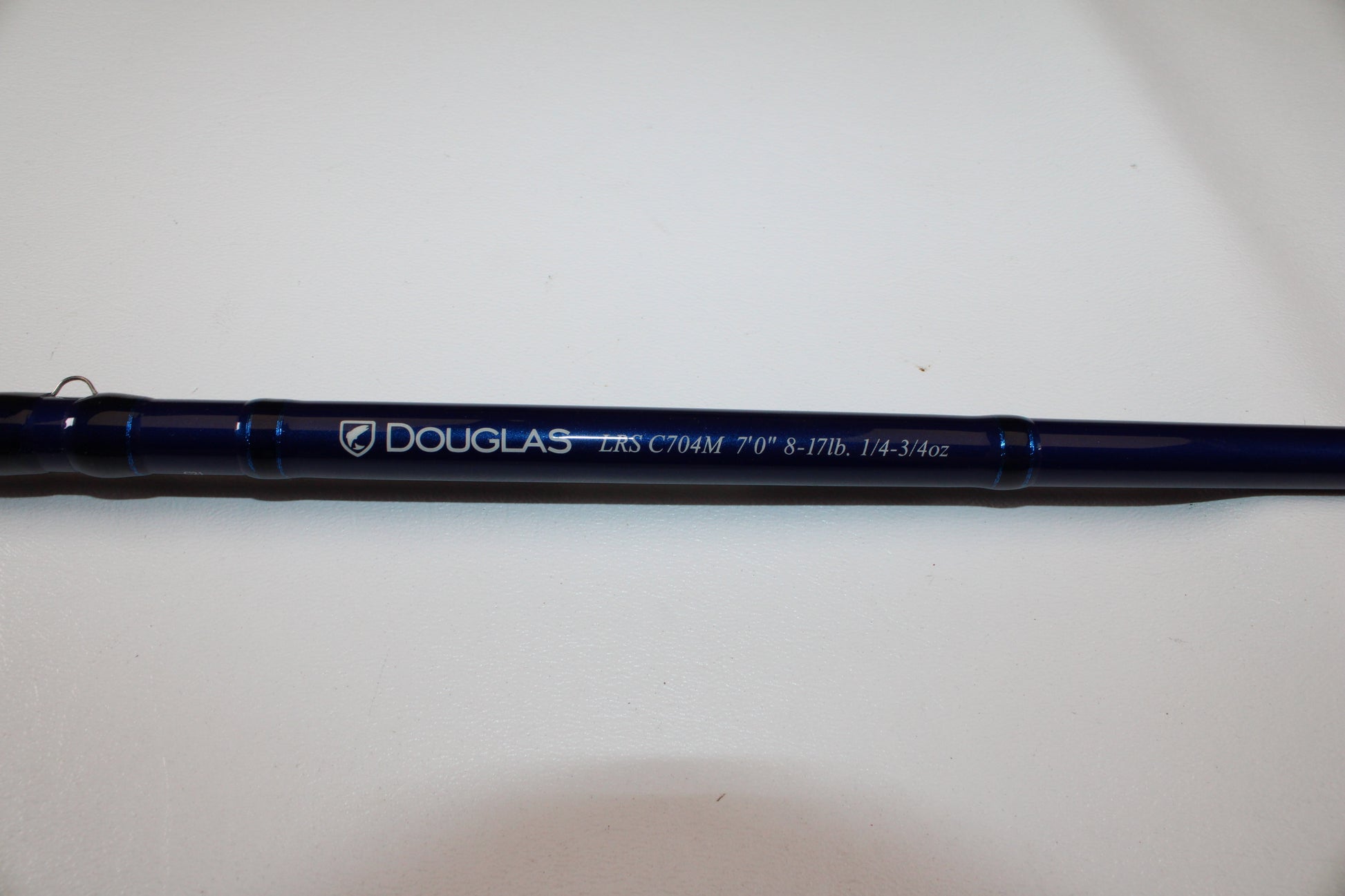 A close-up of the Douglas LRS C704M 7'0" Medium Used Casting Rod in excellent condition against a white background—an ideal upgrade for anglers through our Rod and Reel Trade-In Program for store credit.
