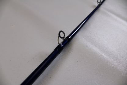 A close-up of the Douglas LRS C704M 7'0" Medium Casting Rod in excellent used condition highlights two line guides—ideal for anglers trading in gear and earning store credit with our Rod and Reel Trade-In Program.