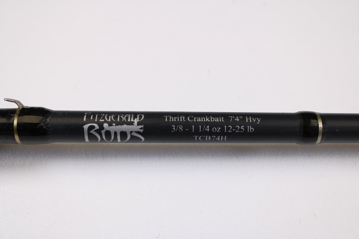 Close-up of a Fitzgerald Bryan Thrift TCB74H 7'4" Heavy Crankbait Used Casting Rod in good condition—eligible for our Rod and Reel Trade-In Program for store credit on used gear.