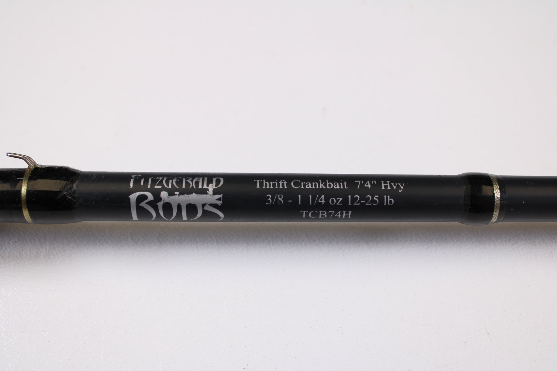 Close-up of a Fitzgerald Bryan Thrift TCB74H 7'4" Heavy Crankbait Used Casting Rod in good condition—eligible for our Rod and Reel Trade-In Program for store credit on used gear.
