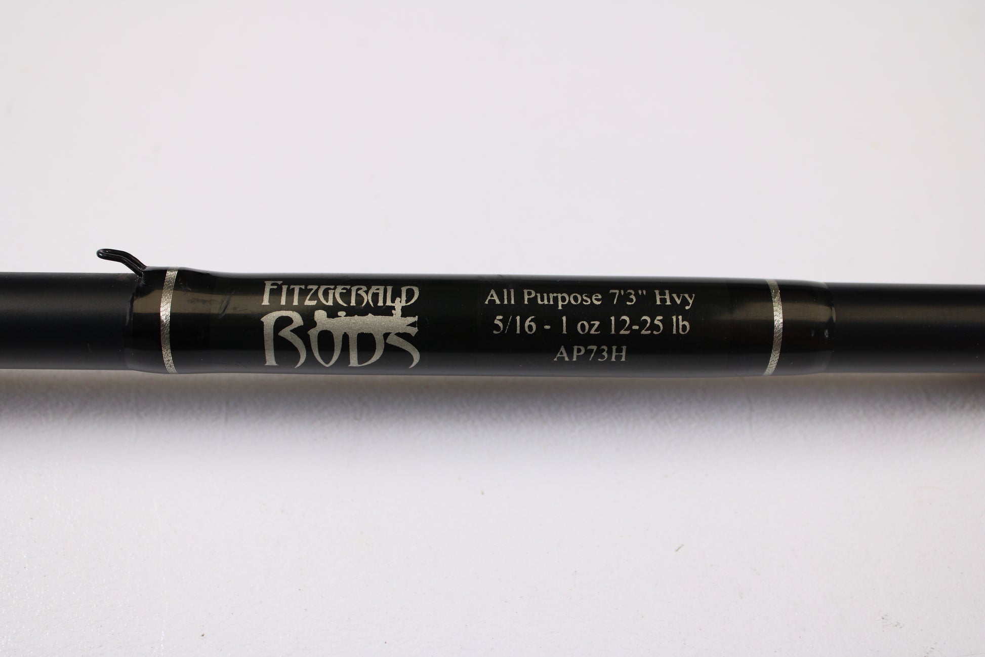 Close-up of a Fitzgerald AP73H 7'3" Heavy Used Casting Rod in very good condition, featuring silver bands and a hook keeper—ideal for anyone using store credit or trading in used gear.
