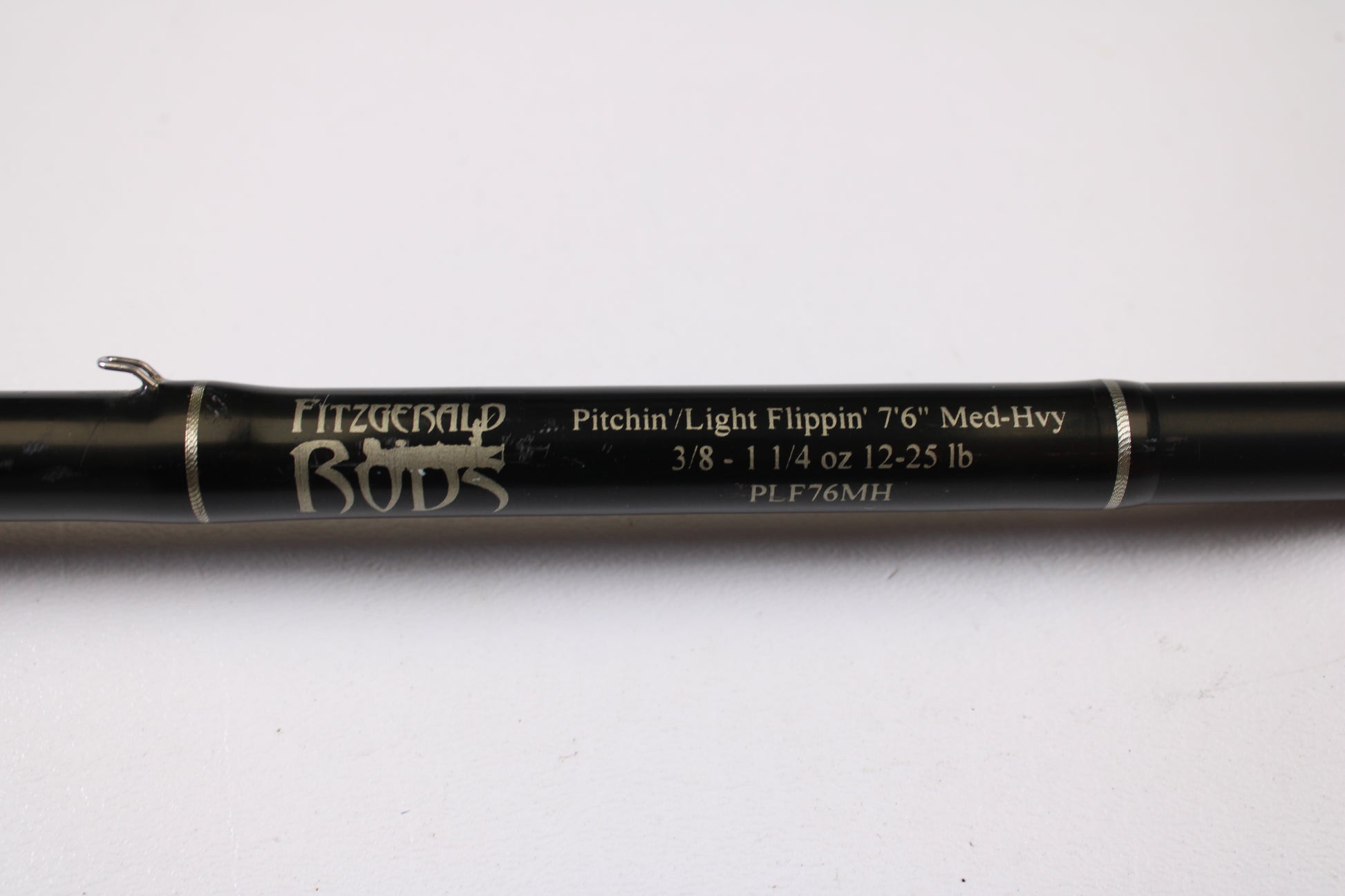 A close-up of a Fitzgerald PLF76MH 7'6" Medium Heavy Used Casting Rod in very good condition. Perfect for anglers exploring our rod and reel trade-in program or looking for quality used gear.