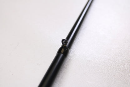 A close-up of a Fitzgerald PLF76MH 7'6" Medium Heavy Used Casting Rod in very good condition, highlighting a line guide against a white textured background.