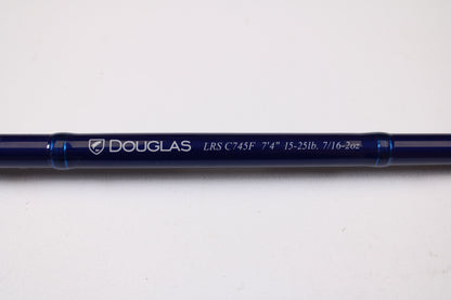 A close-up of a Douglas LRS C745F 7'4" Medium Heavy used casting rod in excellent condition, with clear model lettering, shown on a white background—perfect for those interested in used gear or our rod and reel trade-in program.