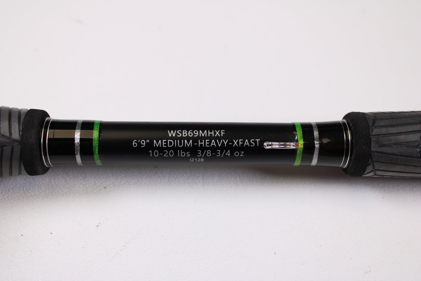 Close-up of the FXtreme Angler Series WSB69MHXF 6'9" Medium Heavy Used Casting Rod—Very Good Condition, by FXtreme, with black, green, and silver accents—ideal for upgrades via our rod and reel trade-in program.