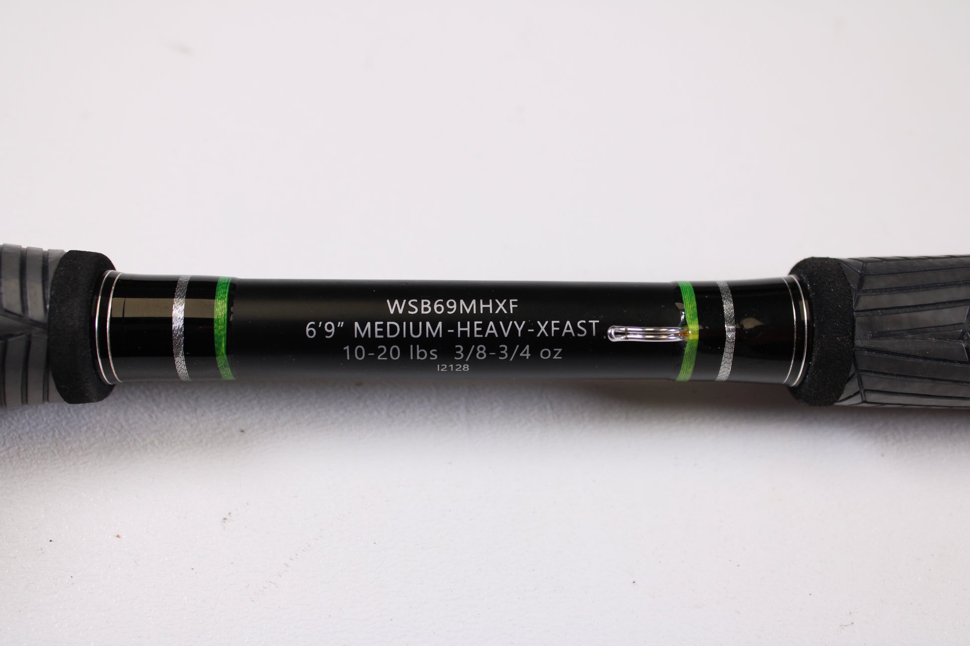 Close-up of the FXtreme Angler Series WSB69MHXF 6'9" Medium Heavy Used Casting Rod—Very Good Condition, by FXtreme, with black, green, and silver accents—ideal for upgrades via our rod and reel trade-in program.