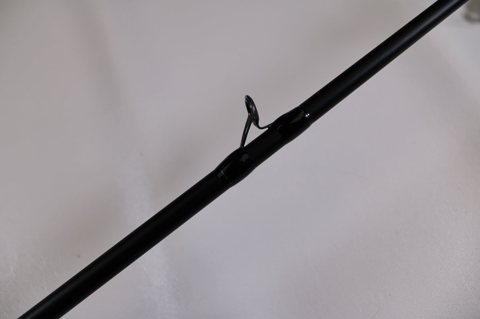 Close-up of a Dobyns Champion XP DC795SB Used Casting Rod in excellent condition, featuring a single metal guide ring—perfect for upgrading your fishing gear or trading in through our rod and reel program.
