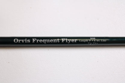 A close-up of a Sage Orvis Frequent Flyer 908 9'0" 8wt 7pc used fly rod in excellent condition, resting on a white surface—ideal for those interested in pre-owned gear or the Rod and Reel Trade-In Program.