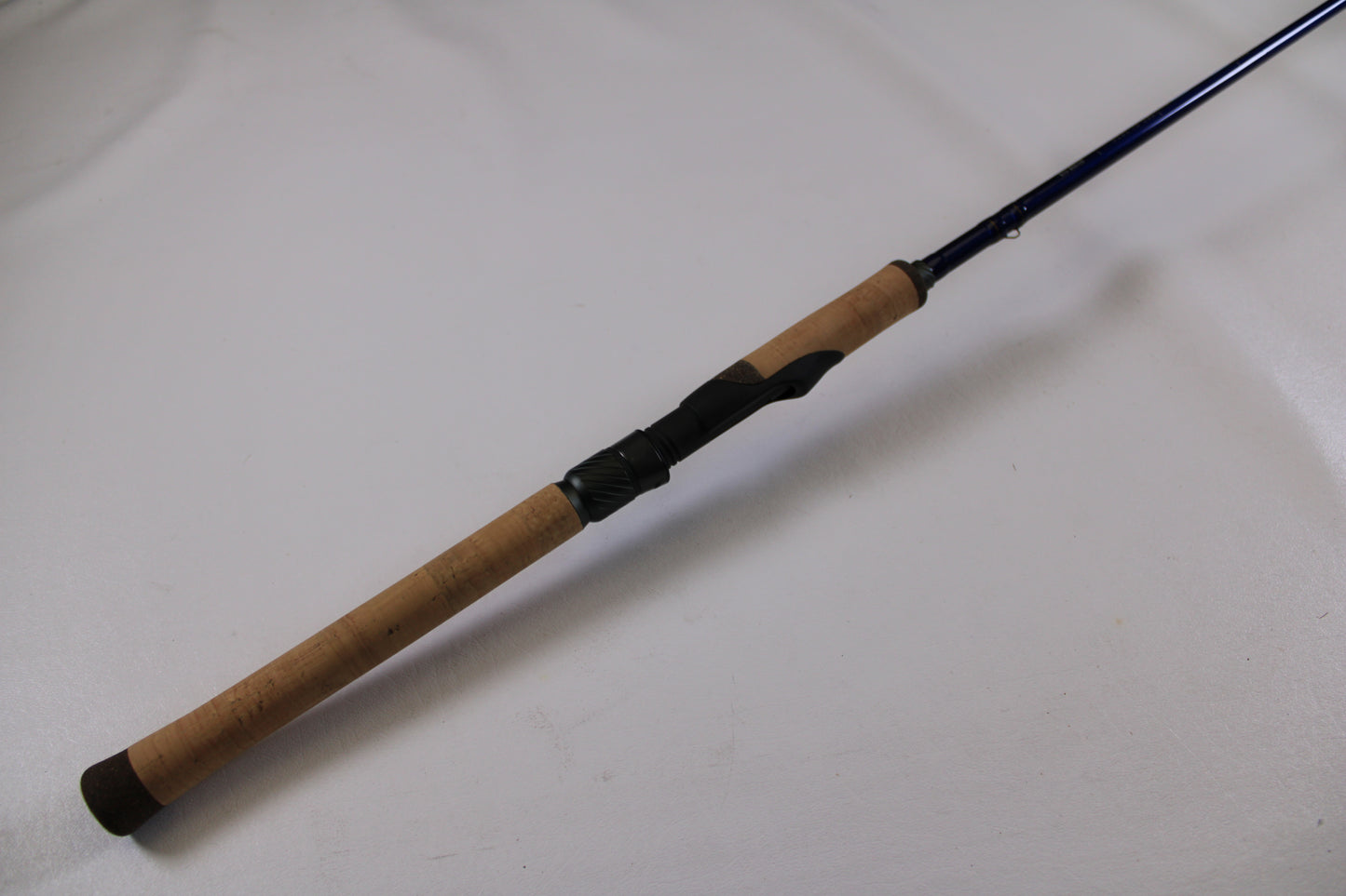 Upgrade your used gear with our Rod and Reel Trade-In Program—check out the St. Croix Legend Tournament Walleye LWTS66MF Used Spinning Rod in excellent condition, featuring a cork handle and blue reel seat, against a plain white background.