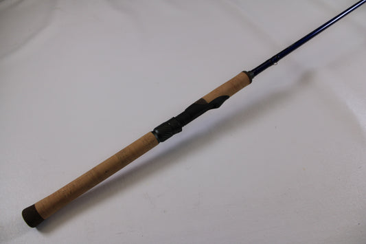 Upgrade your used gear with our Rod and Reel Trade-In Program—check out the St. Croix Legend Tournament Walleye LWTS66MF Used Spinning Rod in excellent condition, featuring a cork handle and blue reel seat, against a plain white background.