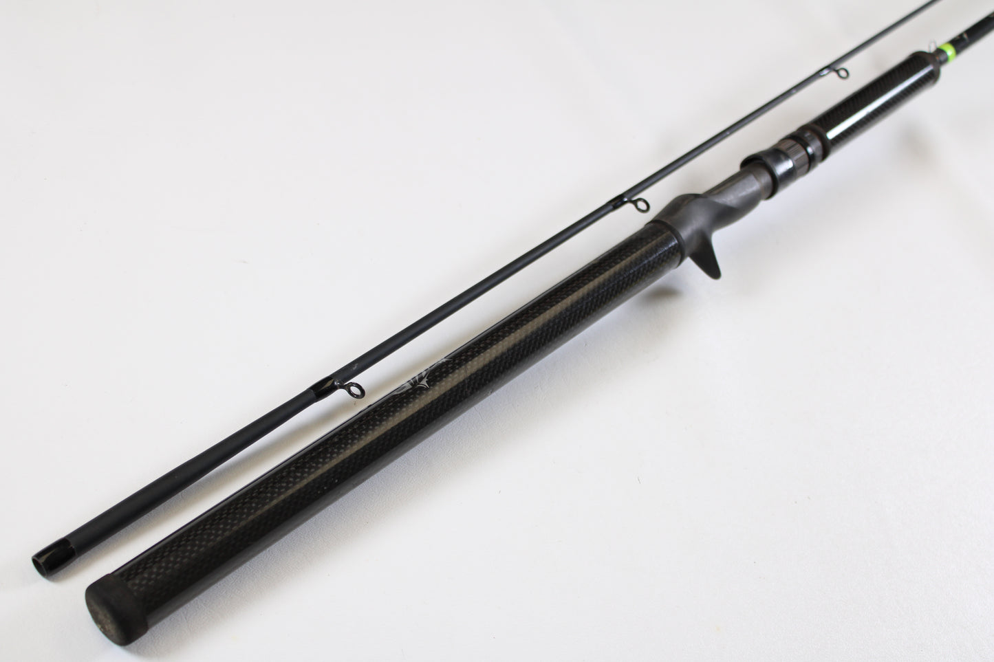 The G. Loomis E6X Hot Shot 1021-2C HSR GH 8'6" Mag Medium 2pc Casting Rod (Used, Good Condition) features a black finish with a textured handle and two visible line guides—ideal for our rod and reel trade-in program.