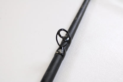 Close-up of a G. Loomis E6X Hot Shot 1021-2C HSR GH 8'6" Mag Medium 2pc Used Casting Rod guide—ideal for upgrading via our rod and reel trade-in program or exchanging used G. Loomis gear for store credit.