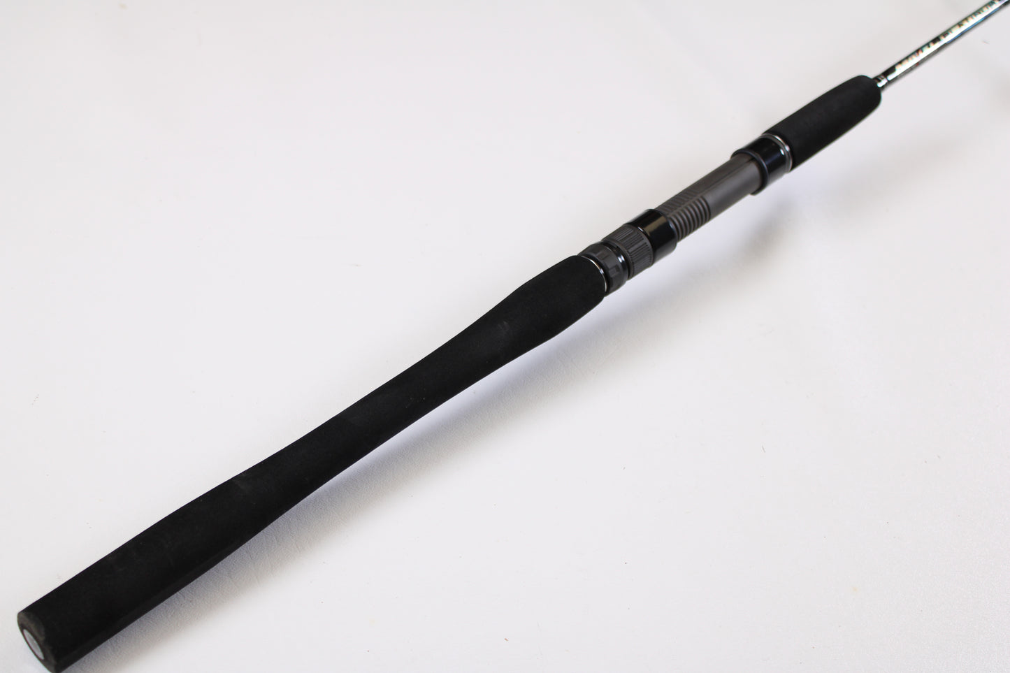 A close-up of the Maxel Platinum Slow Pitch MPSPS 661MH 6'6" Medium Heavy Used Spinning Rod handle in mint condition, perfect for anglers seeking quality used gear or trading in a rod and reel.