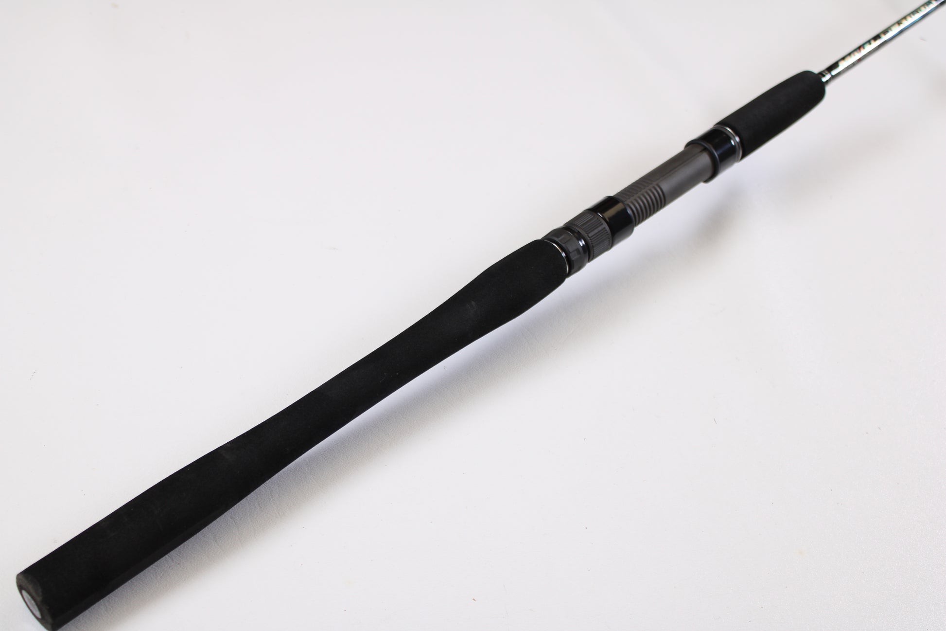 A close-up of the Maxel Platinum Slow Pitch MPSPS 661MH 6'6" Medium Heavy Used Spinning Rod handle in mint condition, perfect for anglers seeking quality used gear or trading in a rod and reel.
