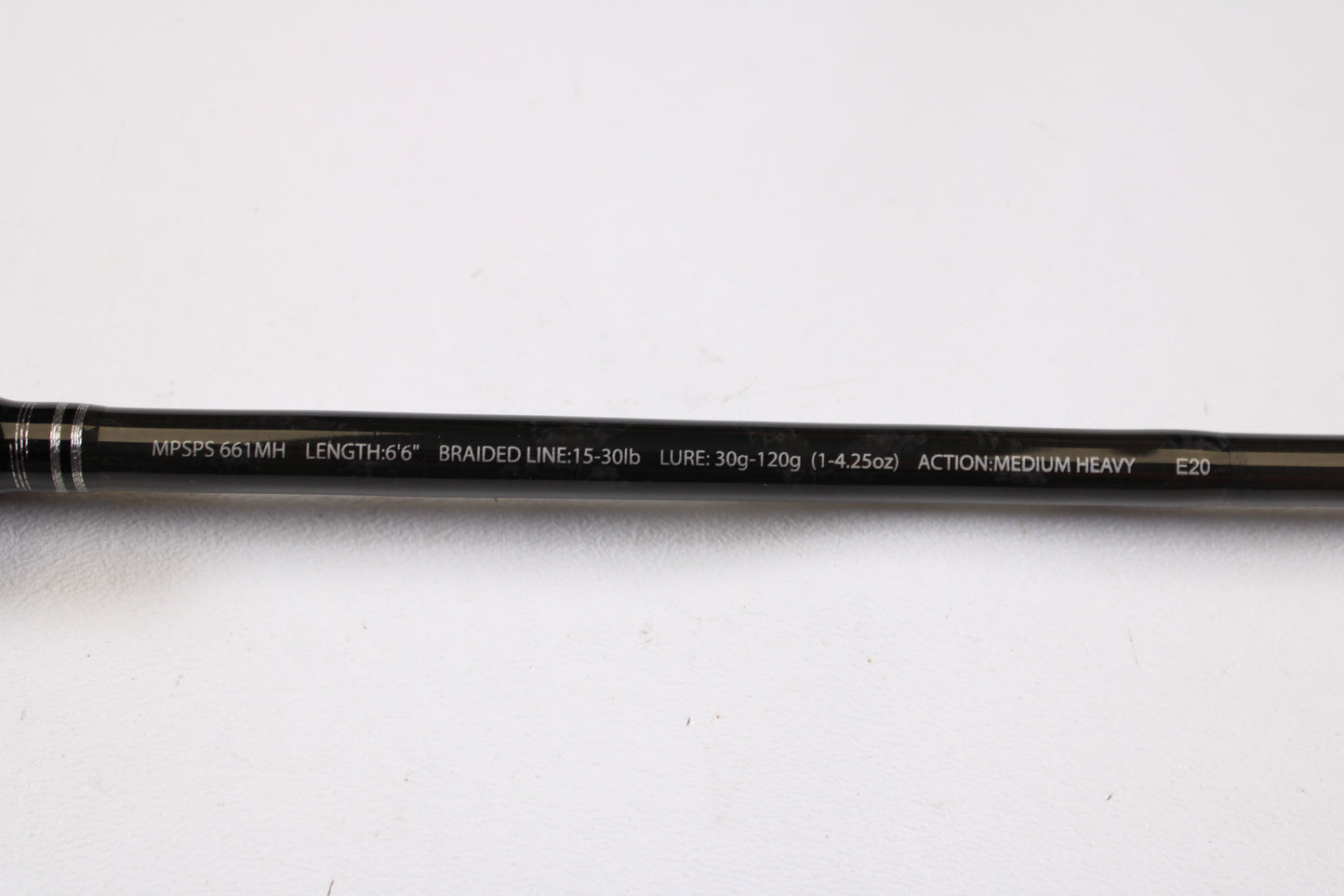 A close-up of a Maxel Platinum Slow Pitch MPSPS 661MH 6'6" medium heavy used spinning rod in mint condition, displaying its specs—perfect for anglers interested in quality used gear or a rod and reel trade-in.