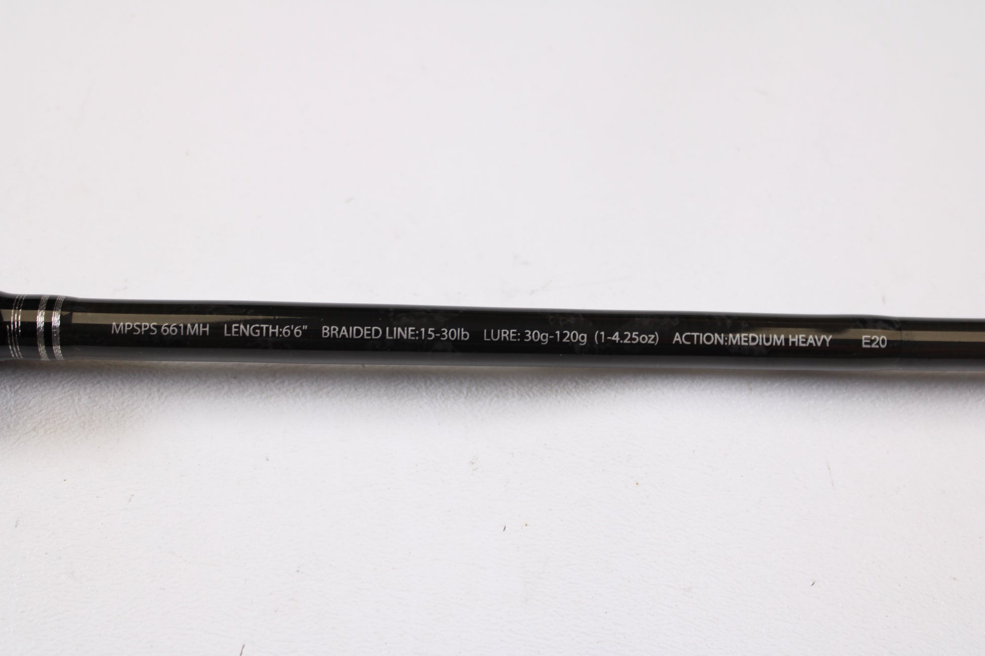 A close-up of a Maxel Platinum Slow Pitch MPSPS 661MH 6'6" medium heavy used spinning rod in mint condition, displaying its specs—perfect for anglers interested in quality used gear or a rod and reel trade-in.