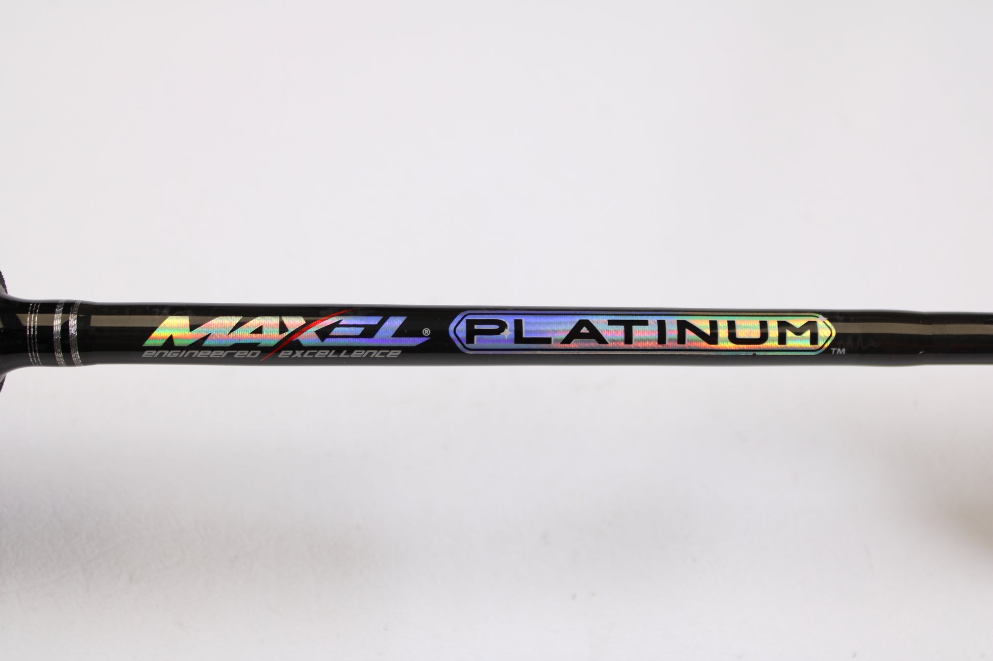 Close-up of a Maxel Platinum Slow Pitch MPSPS 661MH 6'6" Medium Heavy Used Spinning Rod (mint condition) with holographic branding—ideal for those trading in rods and reels or shopping for quality used gear.