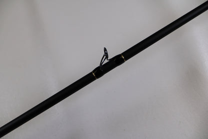 A close-up of the G. Loomis GLX 873c BJR 7'3" Medium Heavy Used Casting Rod in excellent condition, featuring a metal guide ring—ideal for anglers seeking quality used gear or looking to trade in rods and reels.