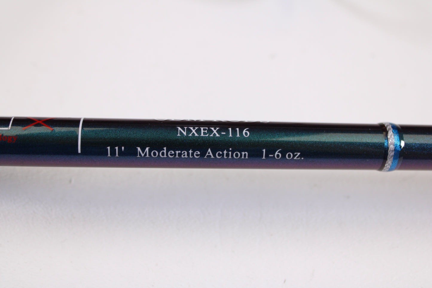 A close-up of the ODM Rods EVO X NXEX-116 11'0" 2pc Used Spinning Rod in excellent condition shows its specs on the shaft—ideal for earning store credit with our Rod and Reel Trade-In Program.