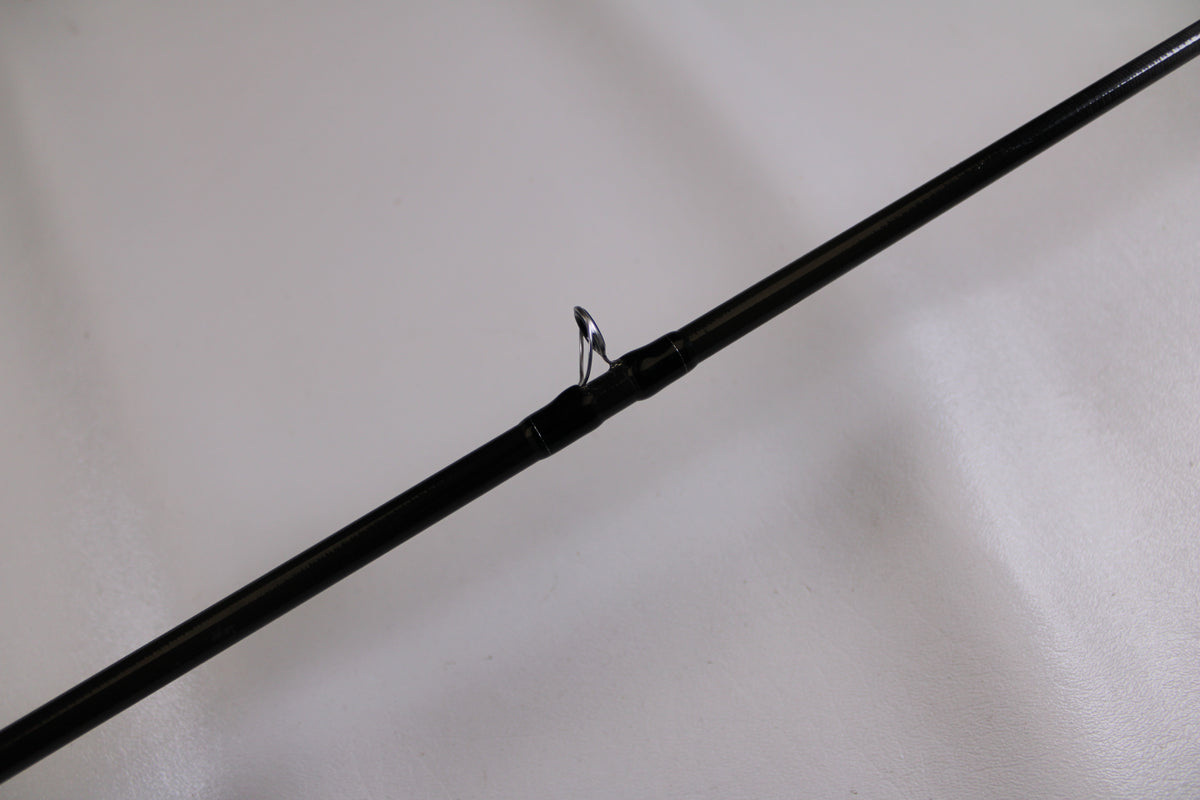 A close-up of the Evergreen Combat Stick RCTC-68M, a used casting rod in excellent condition, highlights its line guide—ideal for anyone seeking quality pre-owned gear or considering our Rod and Reel Trade-In Program.