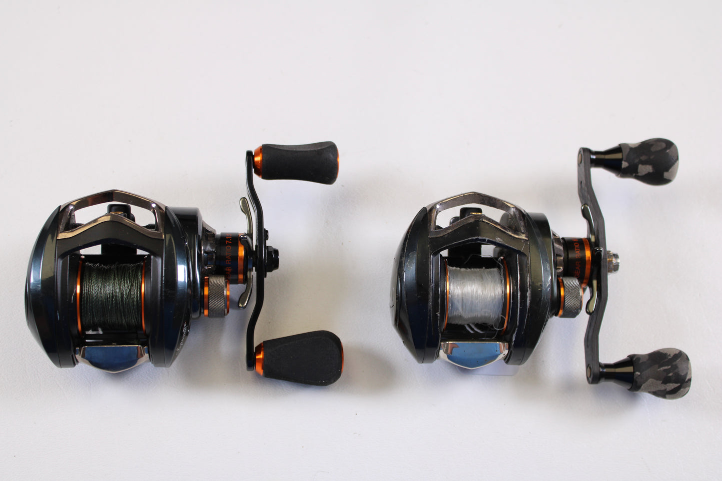 Two Pflueger Supreme XT casting reels—model SUPXT71LP 7.1:1 RH and SUPXT64LP 6.4:1 RH—used, in good condition, are displayed side by side; available for store credit via our Rod and Reel Trade-In Program.