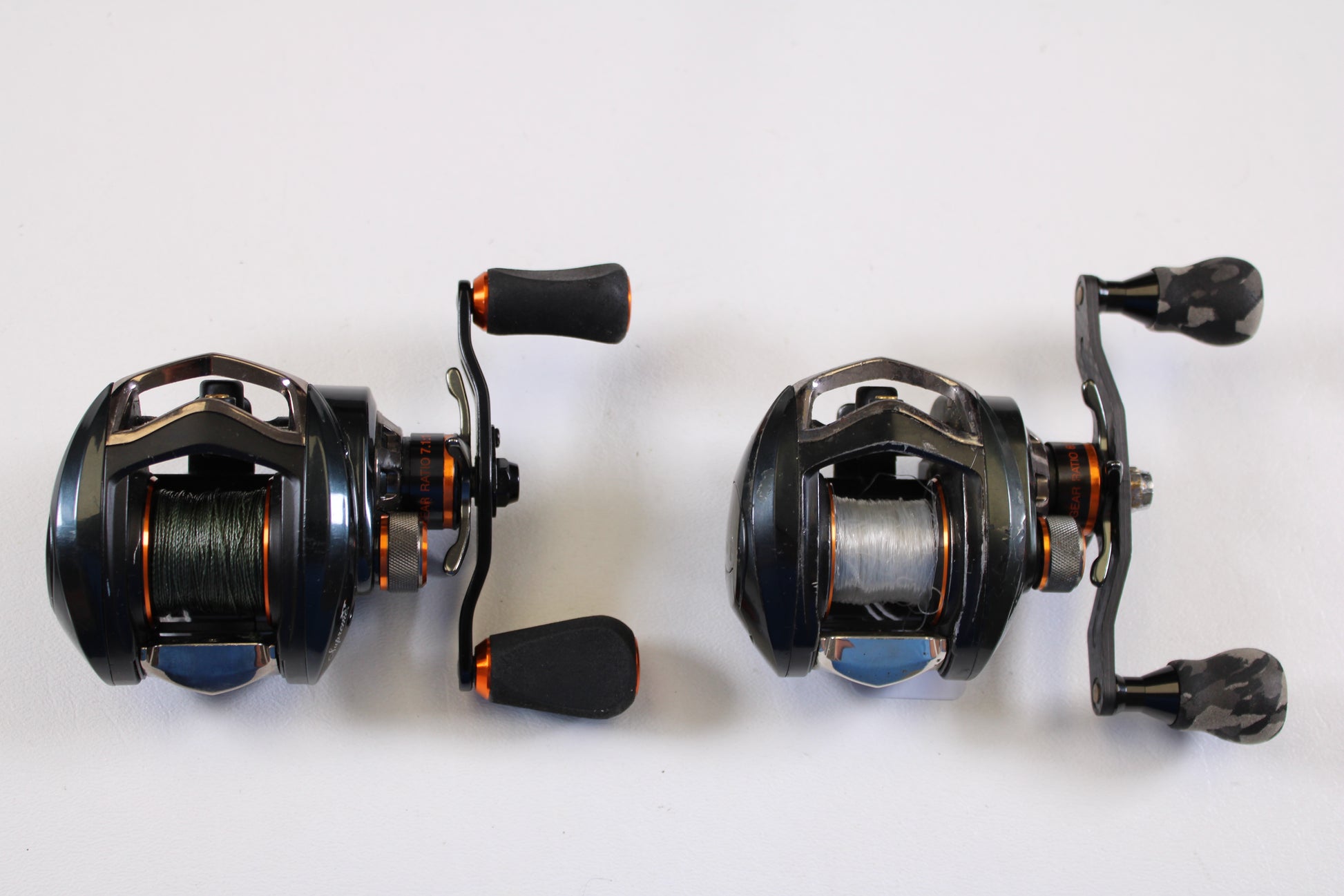 Two Pflueger Supreme XT casting reels—model SUPXT71LP 7.1:1 RH and SUPXT64LP 6.4:1 RH—used, in good condition, are displayed side by side; available for store credit via our Rod and Reel Trade-In Program.