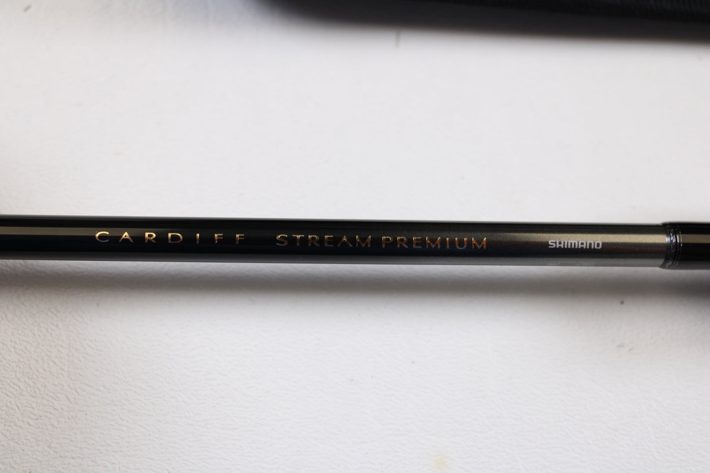 A close-up of a Shimano Cardiff Steam Premium B48UL-G/4 4'8" Ultra Light 4pc used casting rod in mint condition, perfect for anglers considering the Rod and Reel Trade-In Program or upgrading gear for store credit.