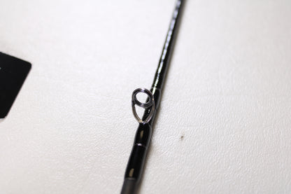 Close-up of a Shimano Cardiff Steam Premium B48UL-G/4 4'8" Ultra Light 4pc Used Casting Rod in mint condition, highlighting a metal line guide. Perfect for our Rod and Reel Trade-In Program—exchange your used gear for store credit.