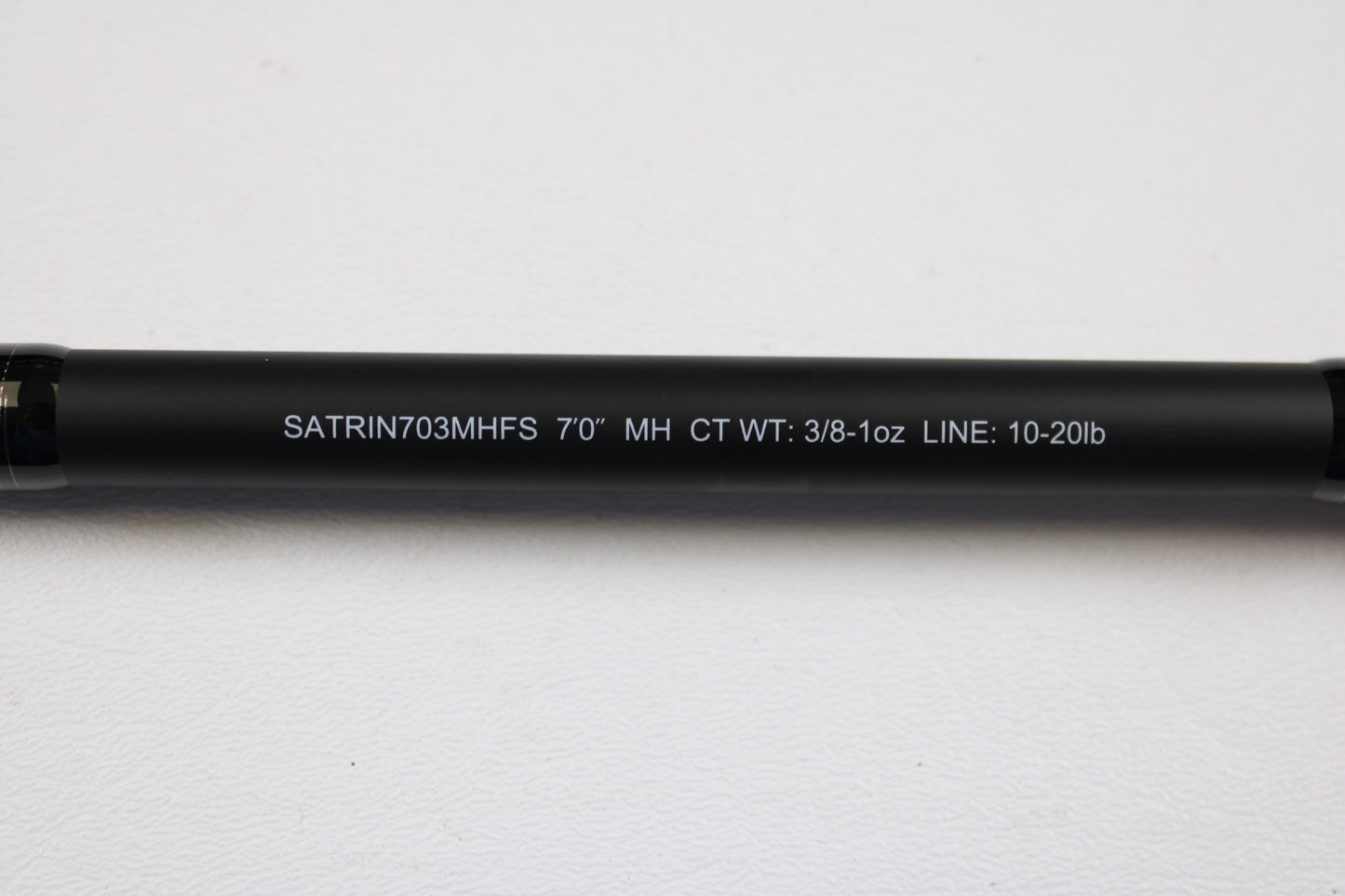 Close-up of a Daiwa Saltiga Inshore Travel SATRIN703MHFS 7'0" medium heavy 3pc spinning rod in excellent condition on white. Ideal for upgrading via our Rod and Reel Trade-In Program; get store credit for your used gear.