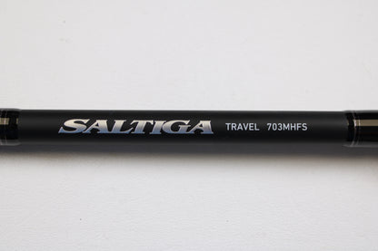 Close-up of a Daiwa Saltiga Inshore Travel SATRIN703MHFS 7'0" Medium Heavy 3pc Used Spinning Rod in excellent condition, shown against a white background—ideal for our Rod and Reel Trade-In Program if you want to upgrade.