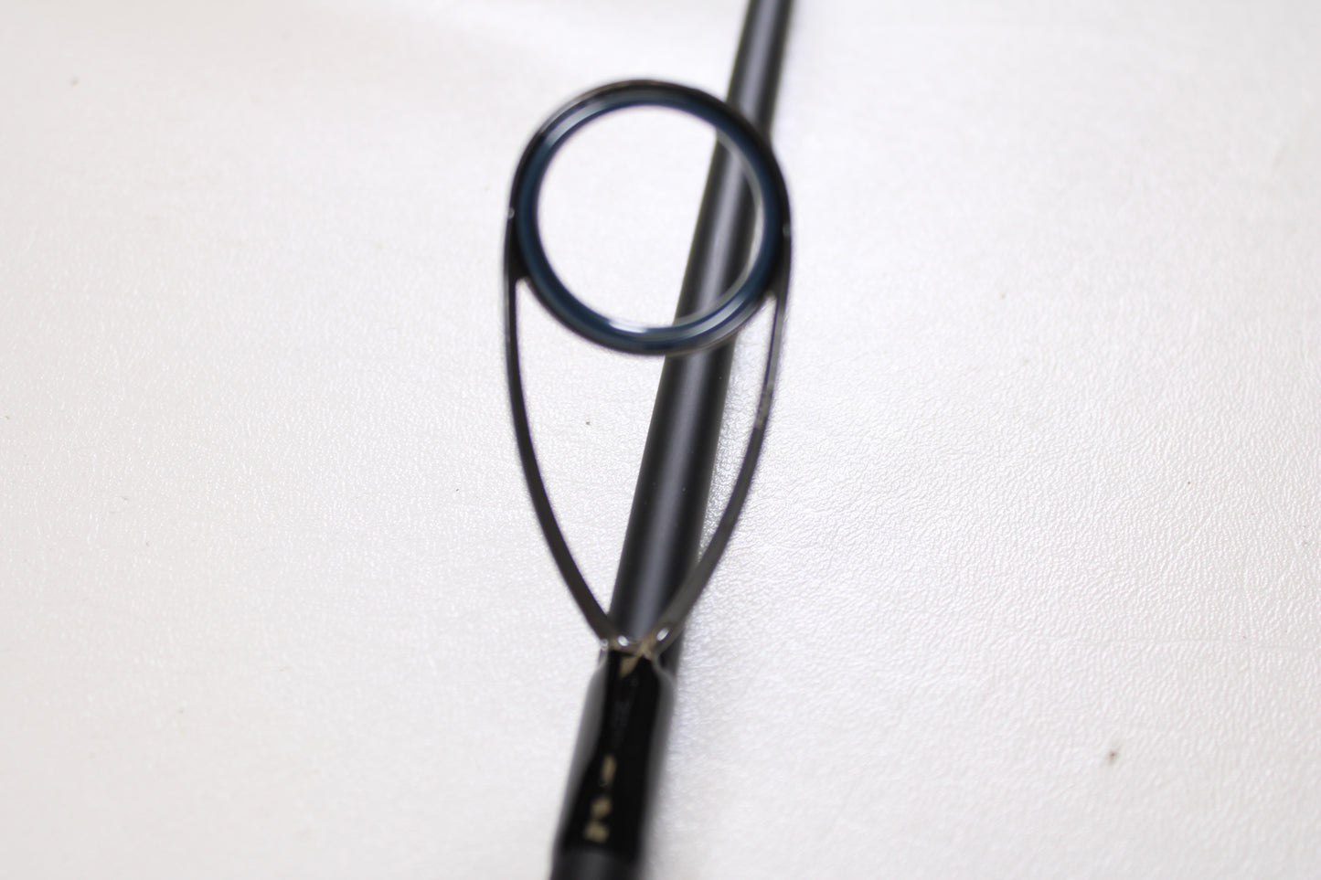 Close-up of a Daiwa Saltiga Inshore Travel SATRIN703MHFS 7'0" Medium Heavy 3pc Used Spinning Rod in excellent condition—ideal for anglers interested in upgrading with our Rod and Reel Trade-In Program.