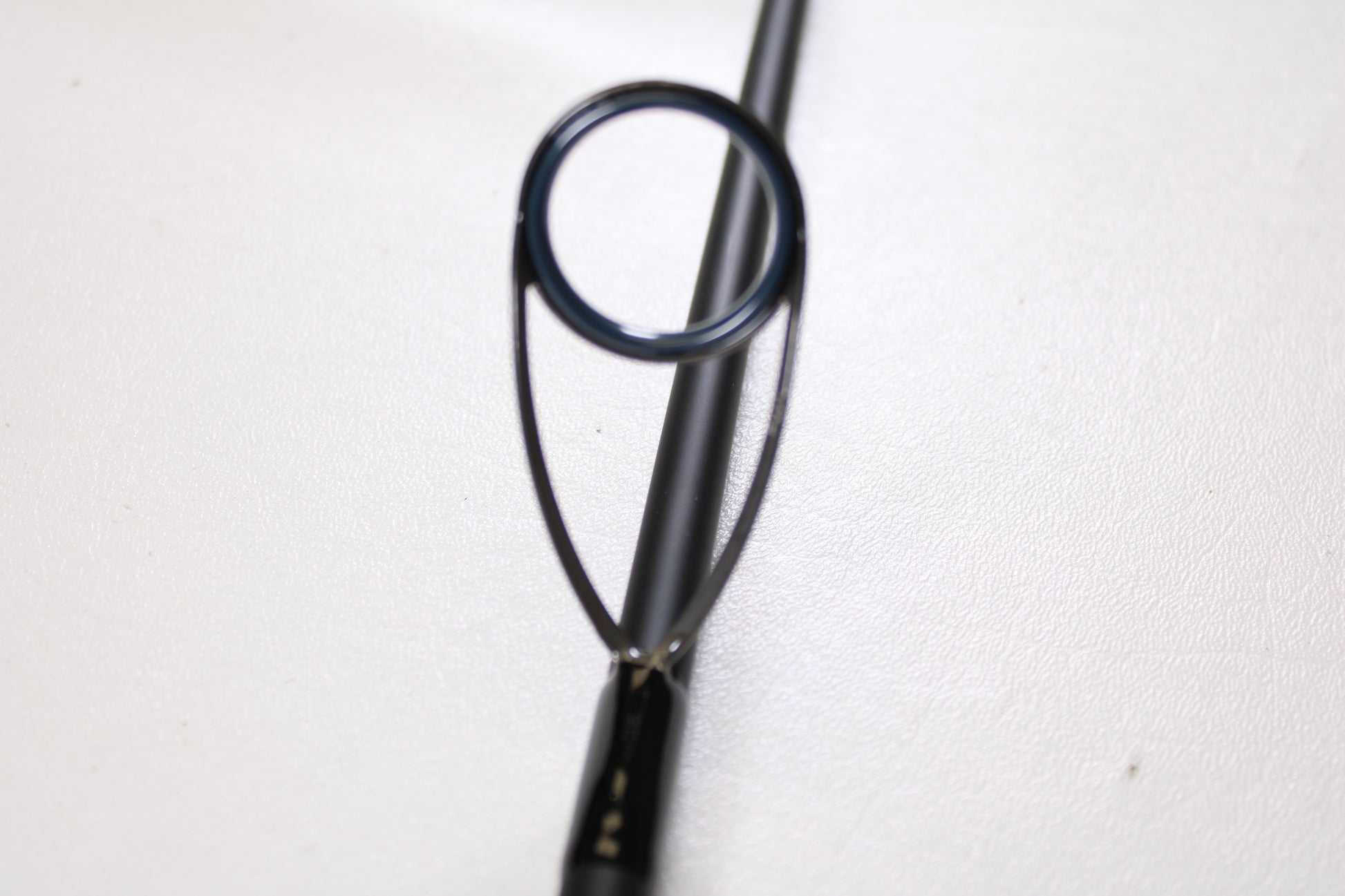 Close-up of a Daiwa Saltiga Inshore Travel SATRIN703MHFS 7'0" Medium Heavy 3pc Used Spinning Rod in excellent condition—ideal for anglers interested in upgrading with our Rod and Reel Trade-In Program.