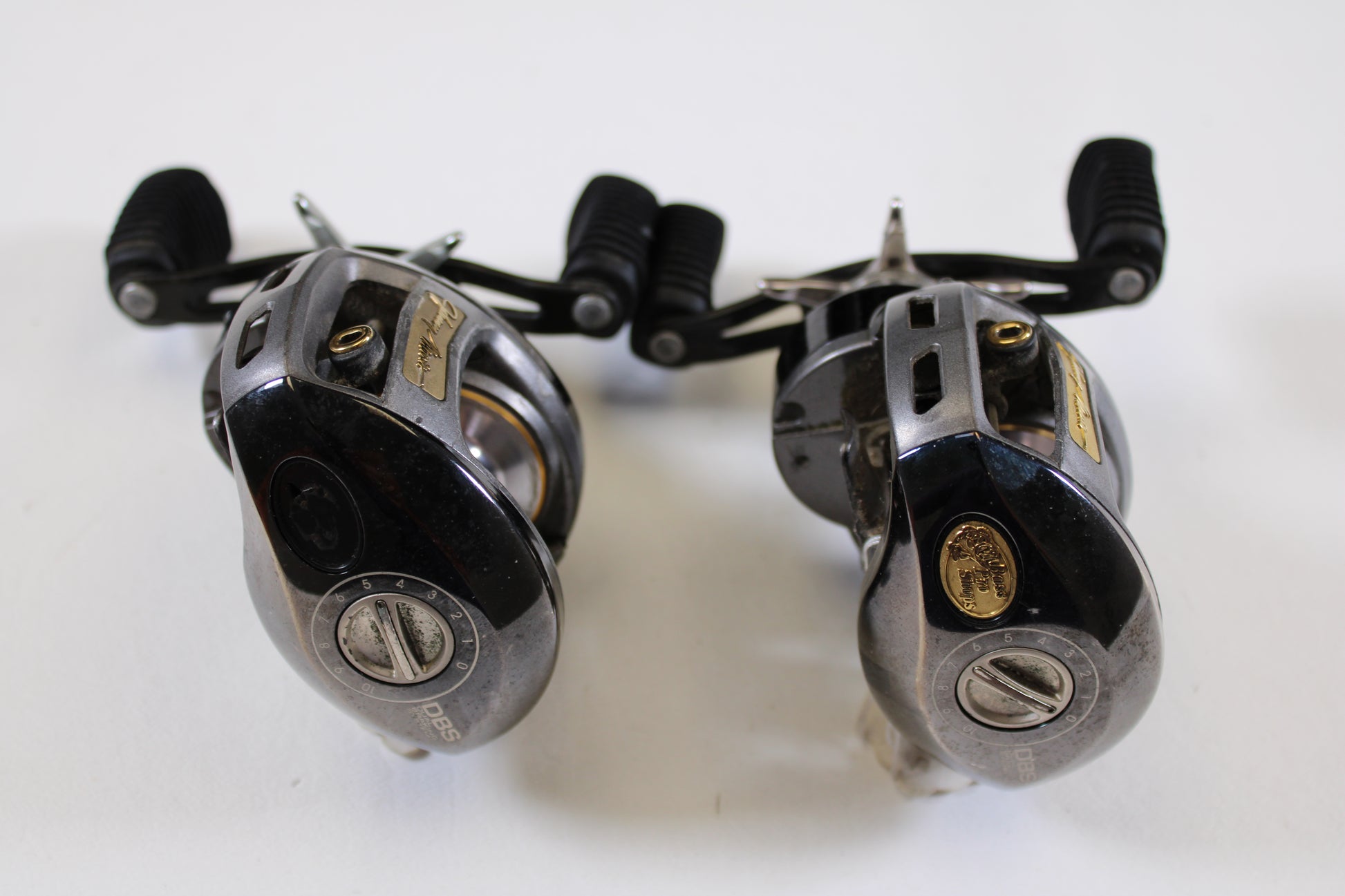 Two Bass Pro Shops Johnny Morris JMX10HD 6.4:1 RH used casting reels in good condition—upgrade through our rod and reel trade-in program or earn store credit on your used gear! Qty: 2.