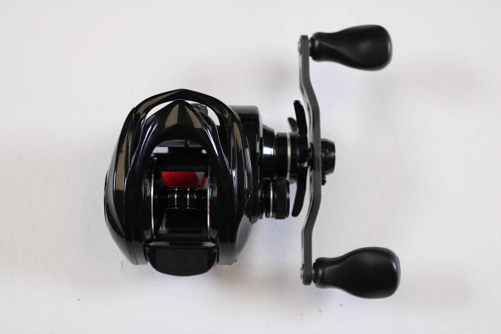 The Kistler Series 1 KS1-R173 7.3:1 RH Used Casting Reel (Good Condition) is shown from above with two ergonomic handles—ideal for anglers looking to upgrade through our trade-in program or browse quality used gear.