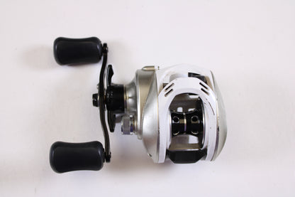 The Okuma Stratus V 6.4:1 LH Used Casting Reel in good condition is shown on a white background—ideal for anglers upgrading their gear with our rod and reel trade-in program.